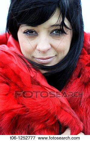 Woman with two different colored eyes and red coat Heterochromia iridium View Large Photo Image Stock Photo - Woman with two different colored eyes and red coat Heterochromia iridium. Fotosearch