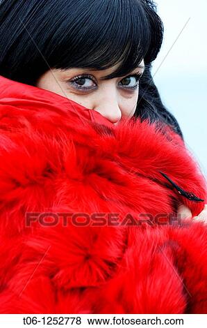 Woman with two different colored eyes and red coat Heterochromia iridium View Large Photo Image Stock Photo - Woman with two different colored eyes and red coat Heterochromia iridium. Fotosearch