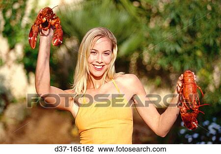 Woman with two lobster View Large Photo Image Stock Image - Woman with two lobster. Fotosearch