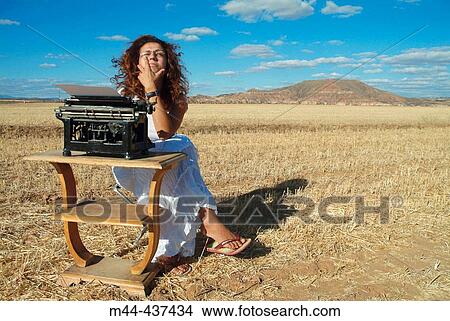Woman with typewriter View Large Photo Image Picture - Woman with typewriter. Fotosearch