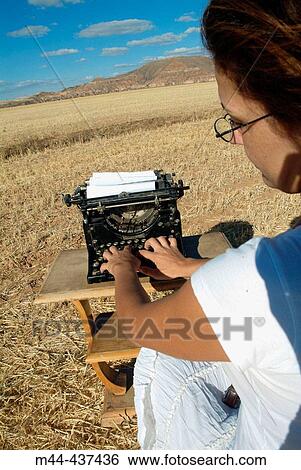 Woman with typewriter View Large Photo Image Stock Photograph - Woman with typewriter. Fotosearch