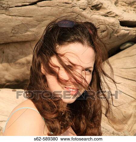 Stock Image - Woman with Wind-Blown Hair. Fotosearch