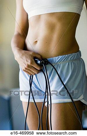 Woman with workout jump ropes View Large Photo Image Stock Photo - Woman with workout jump ropes. Fotosearch