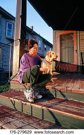 Woman with yellow lab puppy View Large Photo Image Stock Photo - Woman with yellow lab puppy. Fotosearch