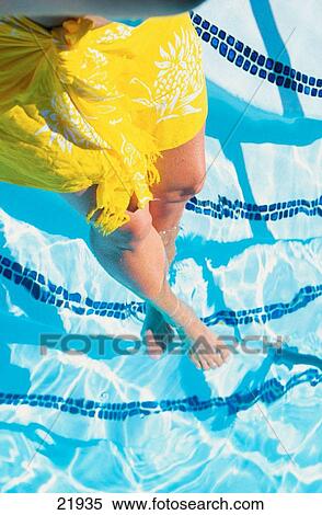 Woman with yellow sarong in pool View Large Photo Image Stock Photography - Woman with yellow sarong in pool. Fotosearch