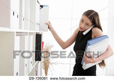 woman working and using phone View Large Photo Image Stock Image - woman working and using phone. Fotosearch
