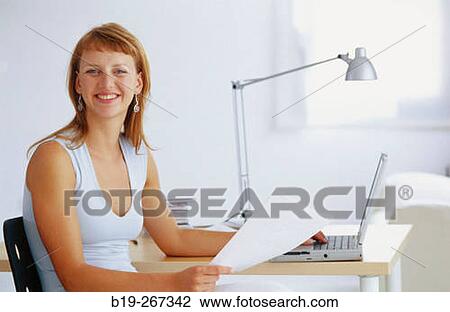 Woman working in the office View Large Photo Image Stock Image - Woman working in the office. Fotosearch
