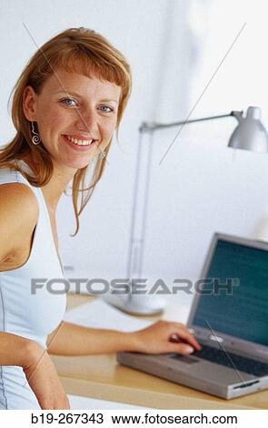 Woman working in the office View Large Photo Image Stock Image - Woman working in the office. Fotosearch
