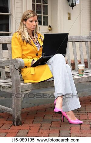 Woman working on laptop outdoors View Large Photo Image Stock Photography - Woman working on laptop outdoors. Fotosearch