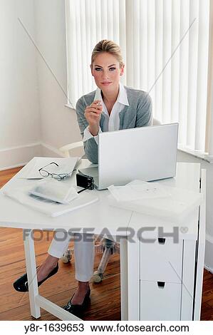 Stock Image - woman working. Fotosearch
