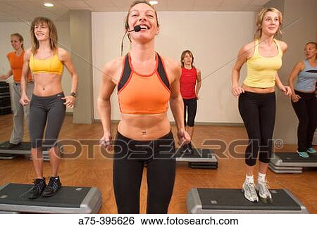 Stock Photograph - womandoing a bodt step class. Fotosearch