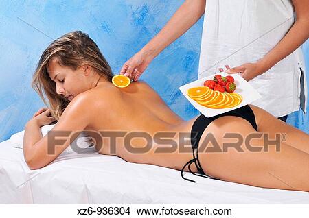 Woman's back and dish with sliced oranges for beauty treatment View Large Photo Image Picture - Woman's back and dish with sliced oranges for beauty treatment. Fotosearch