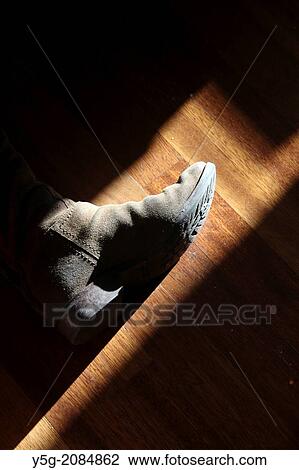 woman's brown leather boot on wooden floor inside house View Large Photo Image Stock Image - woman's brown leather boot on wooden floor inside house. Fotosearch