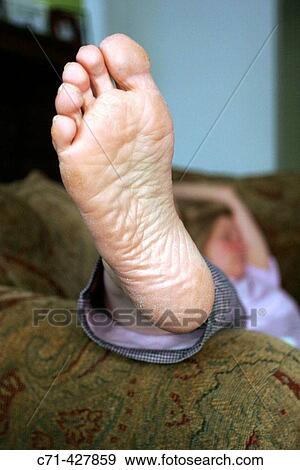 Stock Photo - Woman's foot from underneath. Fotosearch