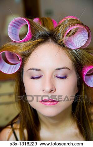 Woman's hair on curlers with eyes closed View Large Photo Image Stock Photo - Woman's hair on curlers with eyes closed. Fotosearch