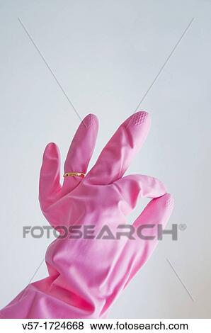 Woman's hand wearing washing glove and a ring View Large Photo Image Stock Photo - Woman's hand wearing washing glove and a ring. Fotosearch