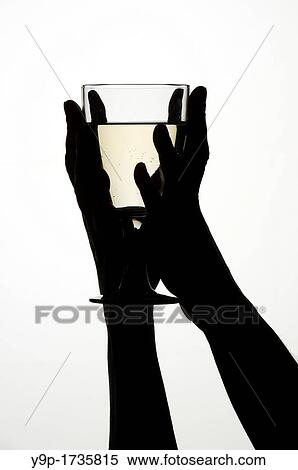 Woman's hands holding a glass of white wine View Large Photo Image Stock Photography - Woman's hands holding a glass of white wine. Fotosearch