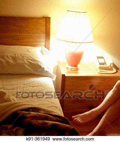 Womans legs in a motel room View Large Photo Image Stock Photo - Womans legs in a motel room. Fotosearch