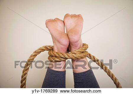 Woman's legs tied with rope View Large Photo Image Stock Photo - Woman's legs tied with rope. Fotosearch