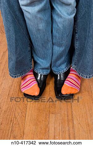 Woman's stocking feet standing on a man's feet, which are enclosed in shoes. View Large Photo Image Stock Image - Woman's stocking feet standing on a man's feet, which are enclosed in shoes.. Fotosearch