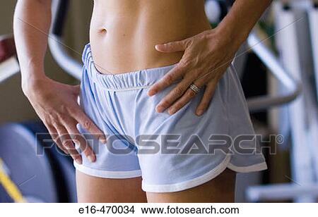 Woman's stomach at workout gym View Large Photo Image Picture - Woman's stomach at workout gym. Fotosearch