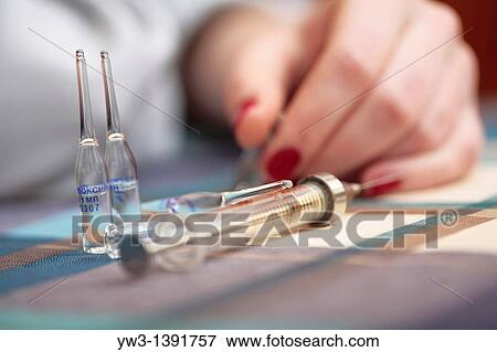 women and drags syringe on the table View Large Photo Image Stock Photo - women and drags syringe on the table. Fotosearch