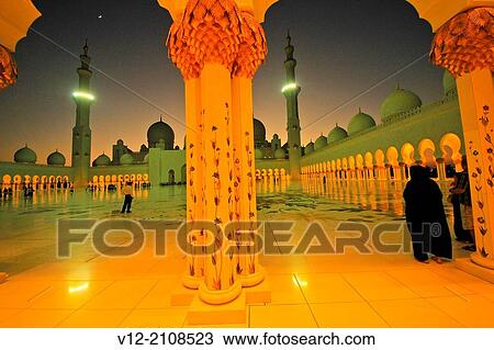 Stock Image - Women at Sheikh Zayed Mosque, Abu Dhabi,. United Arab Emirate. Fotosearch