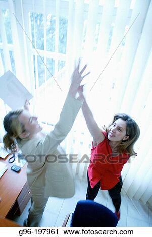 Women at the office View Large Photo Image Stock Image - Women at the office. Fotosearch