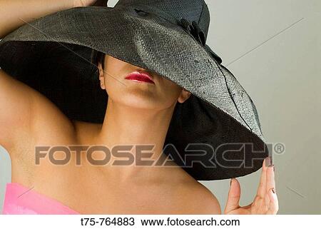 Women behind pamela View Large Photo Image Stock Image - Women behind pamela. Fotosearch