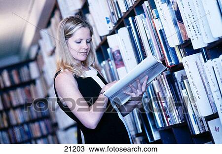 Women browsing at bookstore View Large Photo Image Stock Image - Women browsing at bookstore. Fotosearch