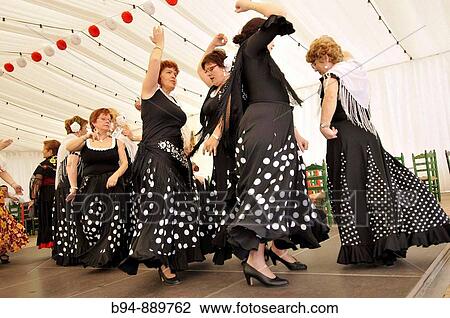 Women dancing flamenco, April Fair, Barcelona. Catalonia, Spain View Large Photo Image Stock Image - Women dancing flamenco, April Fair, Barcelona. Catalonia, Spain. Fotosearch