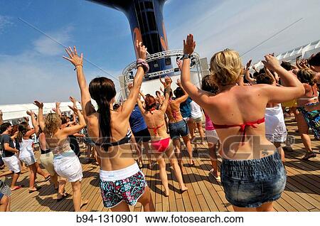 Women dancing on the deck of a cruise ship View Large Photo Image Stock Image - Women dancing on the deck of a cruise ship. Fotosearch