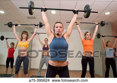 women doing a body pump class at the gym View Large Photo Image Picture - women doing a body pump class at the gym. Fotosearch
