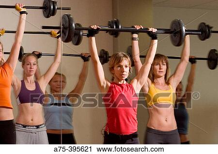 Women doing a body pump class View Large Photo Image Stock Image - Women doing a body pump class. Fotosearch