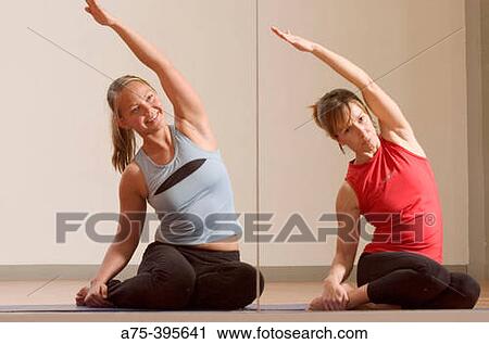 women doing pilates exercise View Large Photo Image Stock Image - women doing pilates exercise. Fotosearch