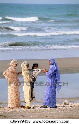 women dressed with sari on the beach of Barka, Sultanate of Oman, Arabian Peninsula, Asia View Large Photo Image Stock Photo - women dressed with sari on the beach of Barka, Sultanate of Oman, Arabian Peninsula, Asia. Fotosearch