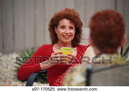 Women friends talking in garden View Large Photo Image Stock Photography - Women friends talking in garden. Fotosearch