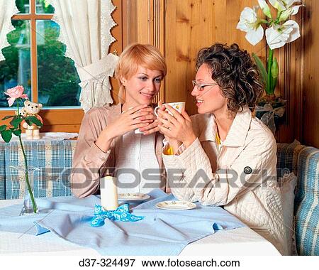Women having afterlunch coffee View Large Photo Image Stock Photo - Women having afterlunch coffee. Fotosearch