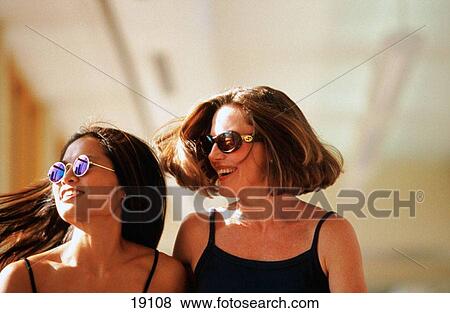 Stock Photo - Women having fun together. Fotosearch