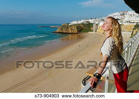 Women in a balcony front the Albufeira beach, Albufeira, Algarve, Portugal View Large Photo Image Stock Image - Women in a balcony front the Albufeira beach, Albufeira, Algarve, Portugal. Fotosearch
