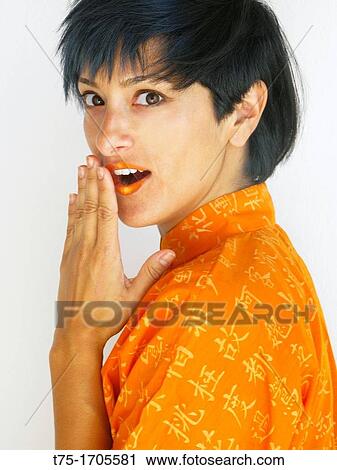 Stock Image - women in Orange. Fotosearch