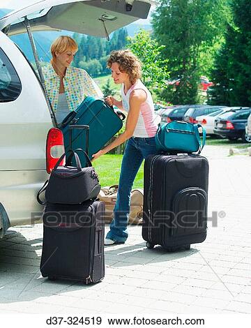 Women in parking loading car View Large Photo Image Stock Photo - Women in parking loading car. Fotosearch
