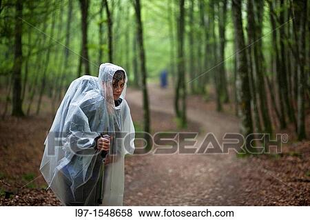 Women in rain coat standing in a forest on the Camino de Santiago near Roncesvalles, Spain View Large Photo Image Stock Photo - Women in rain coat standing in a forest on the Camino de Santiago near Roncesvalles, Spain. Fotosearch