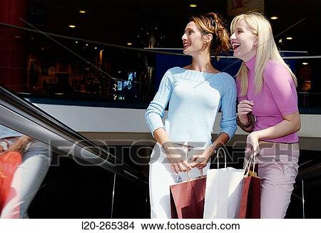 Women in shopping center View Large Photo Image Picture - Women in shopping center. Fotosearch