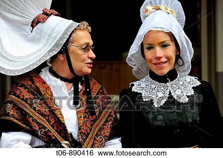 Women in traditionnal dress of year 1900 Festival of the Norman language in St Peter Port Guernsey, Channel Islands, UK View Large Photo Image Stock Photograph - Women in traditionnal dress of year 1900 Festival of the Norman language in St Peter Port Guernsey, Channel Islands, UK. Fotosearch