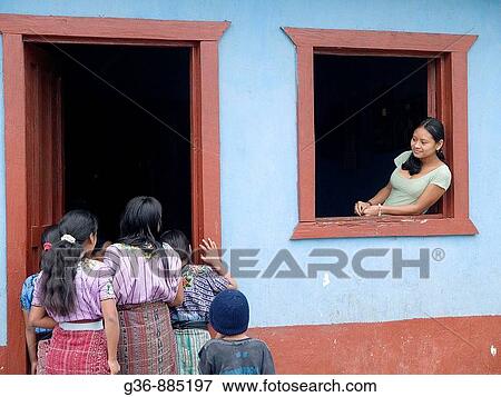 Women in window watching activity in Santiago Atitlan, Solola, Guatemala View Large Photo Image Stock Photo - Women in window watching activity in Santiago Atitlan, Solola, Guatemala. Fotosearch