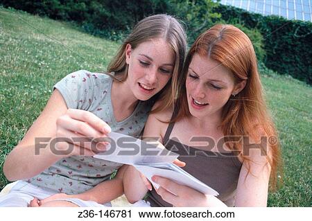 Women looking at photos View Large Photo Image Stock Image - Women looking at photos. Fotosearch