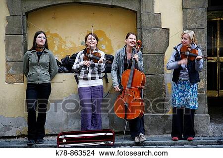 Picture - Women musician play in the street on Stare Mesto, Prague, Czech Republic. Fotosearch