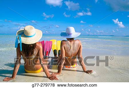 Women on a beach in Ari Atoll. Maldives View Large Photo Image Stock Photo - Women on a beach in Ari Atoll. Maldives. Fotosearch