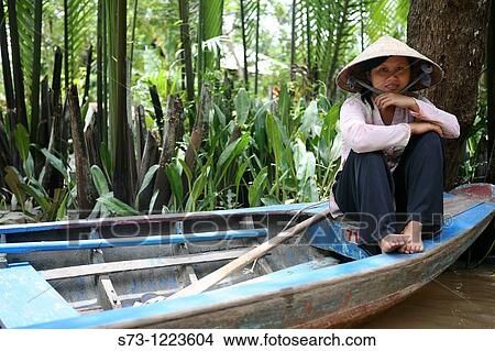 Picture - Women on boat. Mekong River, Mekong Delta, My Duc. Vietnam.. Fotosearch